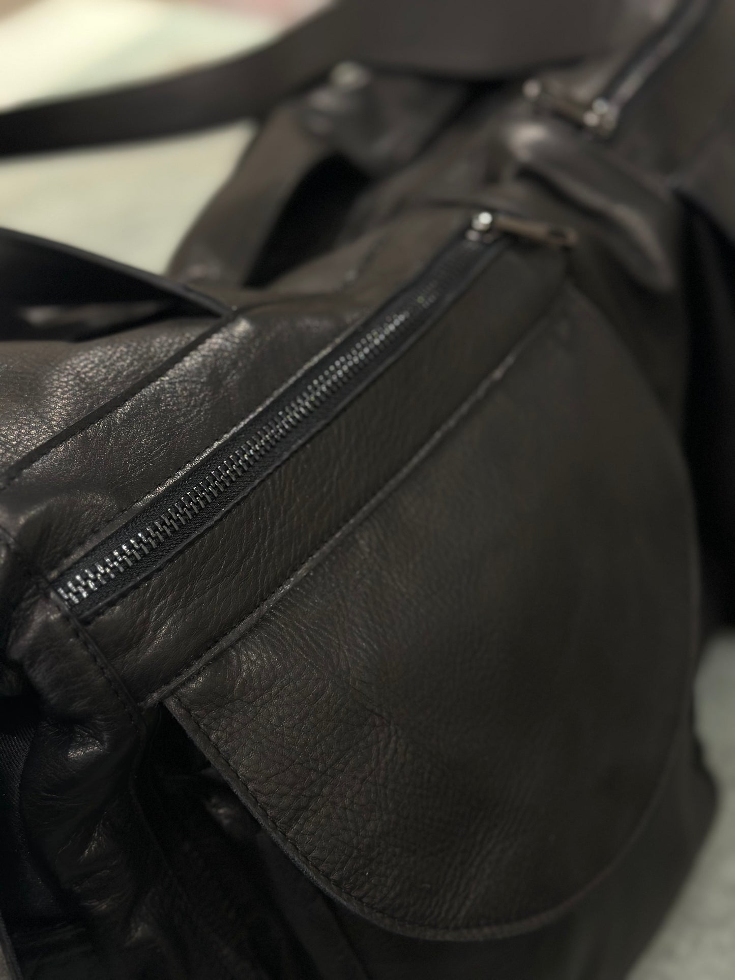 “Prestige 5-Pocket Leather Duffel Bag”